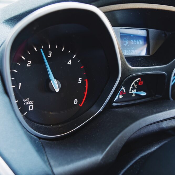 Close-up photo of Gauges and dashboard in ford car.
